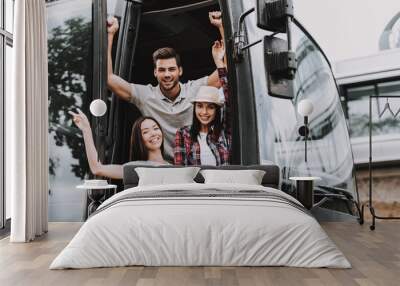 Young Smiling People Traveling on Tourist Bus Wall mural