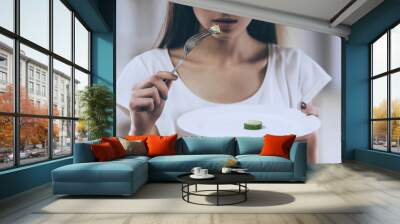 Young Thin Girl Eat Cucumber. Wall mural