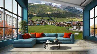 Large panoramic view of Pozza di Fassa, a commune in Trentino at the northern Italia Wall mural