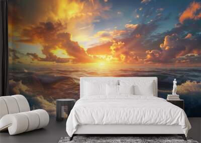 A breathtaking sunset paints the sky in hues of orange and pink as the sun dips below the horizon. The ocean below is a deep blue, with whitecaps cresting the rolling waves. The clouds above are a mix Wall mural