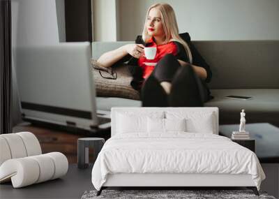 Business woman enjoy her coffee at home office Wall mural