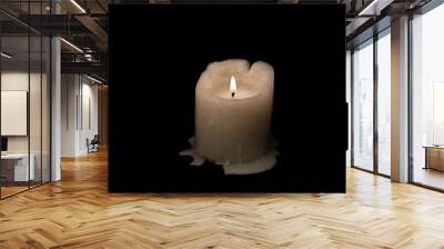 Candle on black background. Horizontal image Wall mural