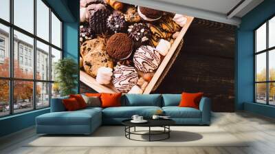 chocolate chip cookies, biscuits, sweets assortment in craft wooden box. sweet food, culinary background. confectionery design concept Wall mural