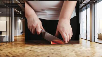 Closeup portrait of woman cooking healthy dinner Wall mural