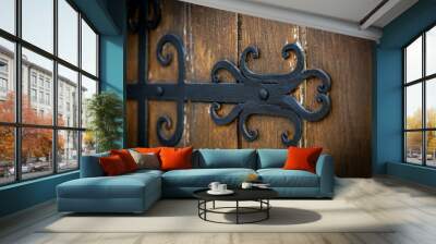 Decorating wooden gates with metal forged elements. Modern exteriors of private houses Wall mural