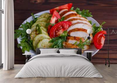 Healthy food, diet concept. Baked chicken breasts with zucchini and salad, close up Wall mural