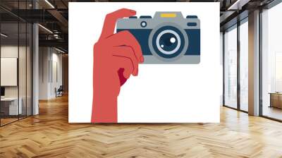 Image of hand with photo camera on empty white background. Wall mural