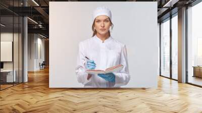 Medical concept of a female doctor in a white coat with a stethoscope, doctor. Wall mural