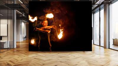 Fire show. Fire dancer dances with. Night performance. Dramatic portrait. Fire and smoke. Wall mural