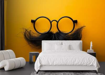 Illustration of a pair of comical glasses and mustache for April Fools' Day. Funny glasses in prank concept on yellow background. Happy April Fool's Day. Wall mural