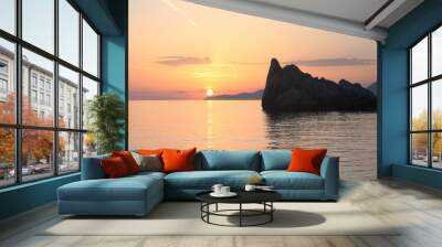 Scenic view of rock in sea at sunset Wall mural