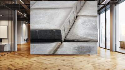 Stack of gray paving slabs. Construction of sidewalks. Building materials for the construction of the sidewalk. Wall mural