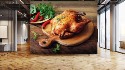 whole roasted chicken on cutting board. wooden rustic background Wall mural