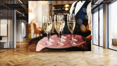 Champagne glasses on sparkling background. Wall mural