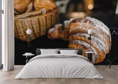 Delicious breakfast with fresh croissants on a black background, delicious baking top view copy space for text Wall mural