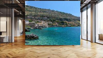 view of  Limeni village with fishing boats in  turquoise waters and the stone buildings as a background  in Mani, South Peloponnese , Greece. Wall mural