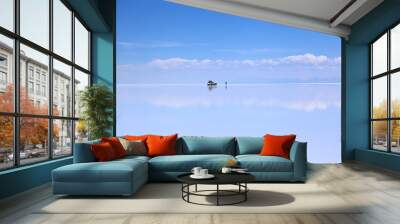 Blue sky and clouds reflected in the water and ice of Uyuni salt lake. in Bolivia Wall mural