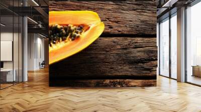 papaya fruit on a wooden background. Selective focus Wall mural