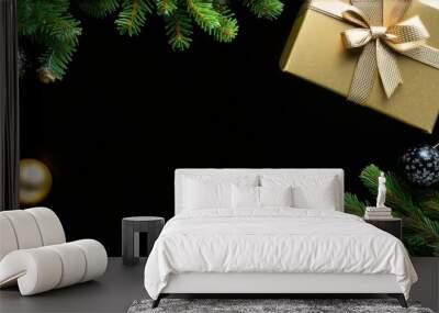 Deluxe holiday wishes concept. Top view of luxurious gift packages, costly tree trimmings, gold and black balls, sparkling confetti, frosted fir twigs on dark backdrop with space for festive words Wall mural