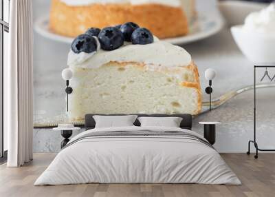 Angel food cake with whipped cream and fresh blueberries.  Wall mural