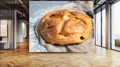 Round loaf of fresh homemade bread with raisin. Crisp. Traditional bakery concept. Rustic style. Copy space. Wall mural