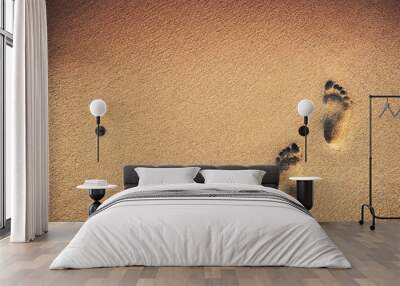 Footsteps on the beach over sand background Wall mural