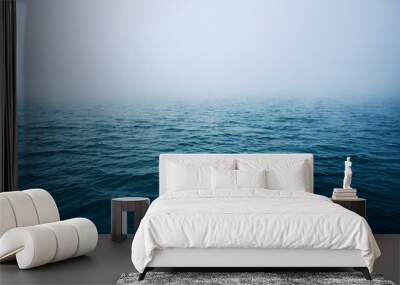 Sea ripple water with morning fog Wall mural