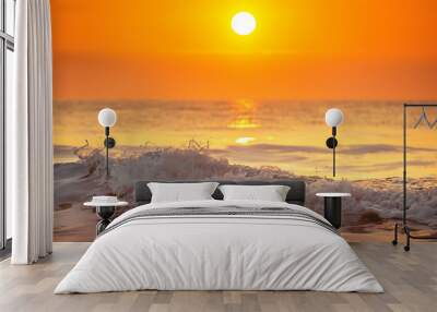 Sunrise and shining waves in ocean Wall mural