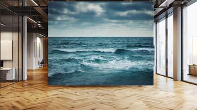 Water waves on cloudy sky background Wall mural