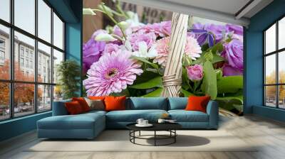 Beautiful bouquet of flowers with a pink gerberа. Focus in the center of the image, the image is slightly blurry edges Wall mural