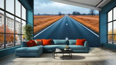 A long empty road in the middle of a field Wall mural