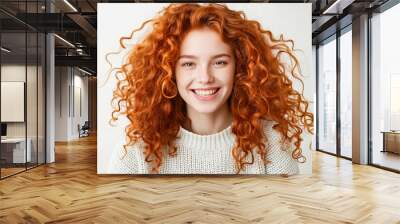 A woman with long red curly hair smiling at the camera Wall mural