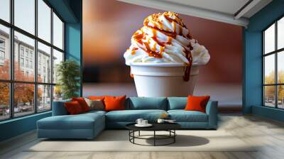 Cup of vanilla ice cream with caramel topping and drizzle. Wall mural