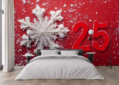 A red background with a snowflake on it and the number 25 in red Wall mural