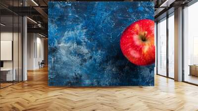 red apple fruit on blue surface Wall mural