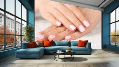 female hand with light pink nail design.... Wall mural