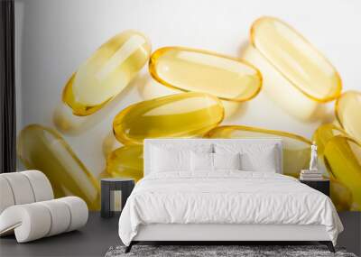 shiny yellow vitamin e fish oil capsule on white background Wall mural