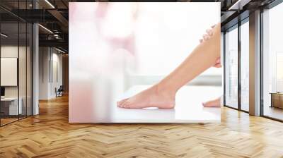 Health, epilation and woman legs in a studio with a shaving, waxing or hair removal treatment. Wellness, depilation and female model with a body care moisturizing routine with mockup bokeh background Wall mural