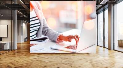 Laptop, bokeh and business woman typing with document for accounting budget research project. Technology, notebook and closeup of professional female accountant working on computer in workplace. Wall mural