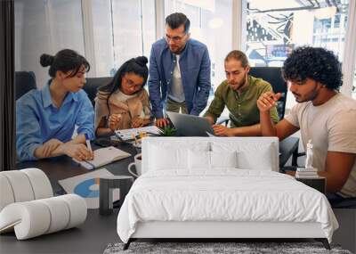 A group of young freelancers working in a coworking space Wall mural