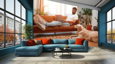 Couple with dog at home Wall mural