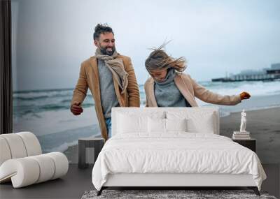 Family on the beach near the sea Wall mural