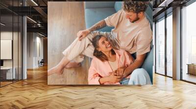 Young couple in love spending time together at home Wall mural