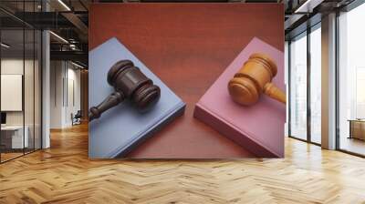 Two judge gavels and legal books on wooden table Wall mural