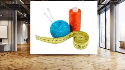 Yellow measuring tape and threads isolated on white Wall mural