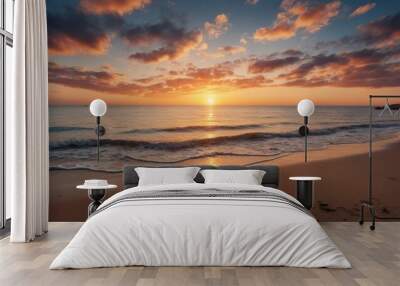 Golden sunset illuminating ocean waves crashing on sandy beach Wall mural