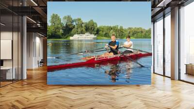 Active healthy lifestyle teens. Boys paddling sport kayak Wall mural