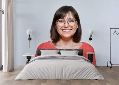 Headshot of smiling middle aged woman looking at camera Wall mural