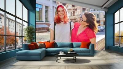 Outdoor portrait of happy mother and daughter of teenager Wall mural