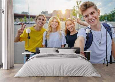 Smiling group of teenagers taking selfie, happy four teens looking at camera Wall mural